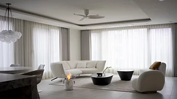 EcoSmart Fire Pillar 3L Designer Fireplace in marble creates a striking freestanding feature for a private indoor living space.