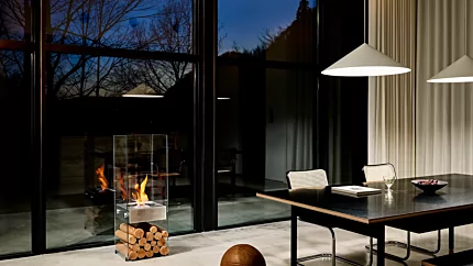 EcoSmart Fire Ghost Designer Fireplace brings modern ethanol heating to a private residence dining room in Japan with a sleek freestanding design.