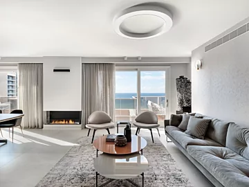 EcoSmart Fire Flex 68SS Flex Fireplace creates a contemporary built-in ethanol fireplace for a private residence living room.